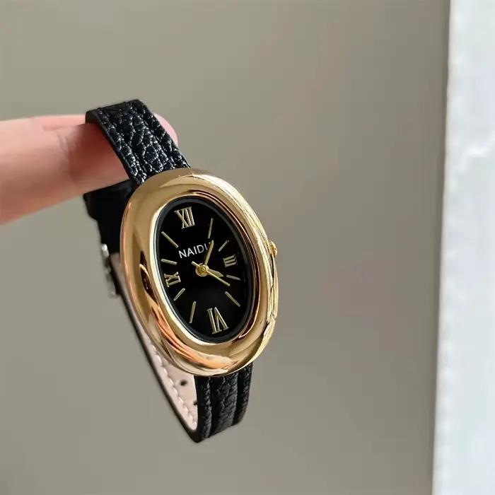 Montre ovale luxueuse style rétro haute qualité pour femmes occasions spéciales quartz bracelet large polyvalent