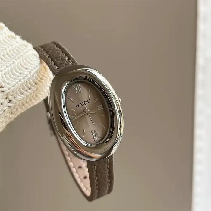 Montre ovale luxueuse style rétro haute qualité pour femmes occasions spéciales quartz bracelet large polyvalent