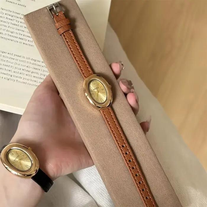 Montre ovale luxueuse style rétro haute qualité pour femmes occasions spéciales quartz bracelet large polyvalent